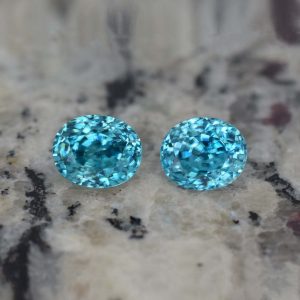 BlueZircon_oval_pair_8.1x6.7mm_7.73cts_H_zn819_b_crop_SOLD