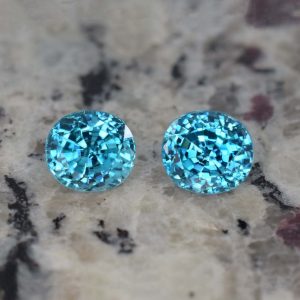 BlueZircon_roval_pair_8.3x7.5mm_8.75cts_H_zn1075_b_crop_SOLD