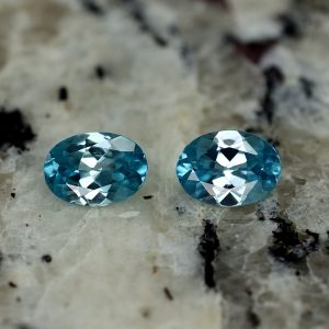 BlueZircon_oval_pair_7.5x5.4mm_2.43cts_zn2617